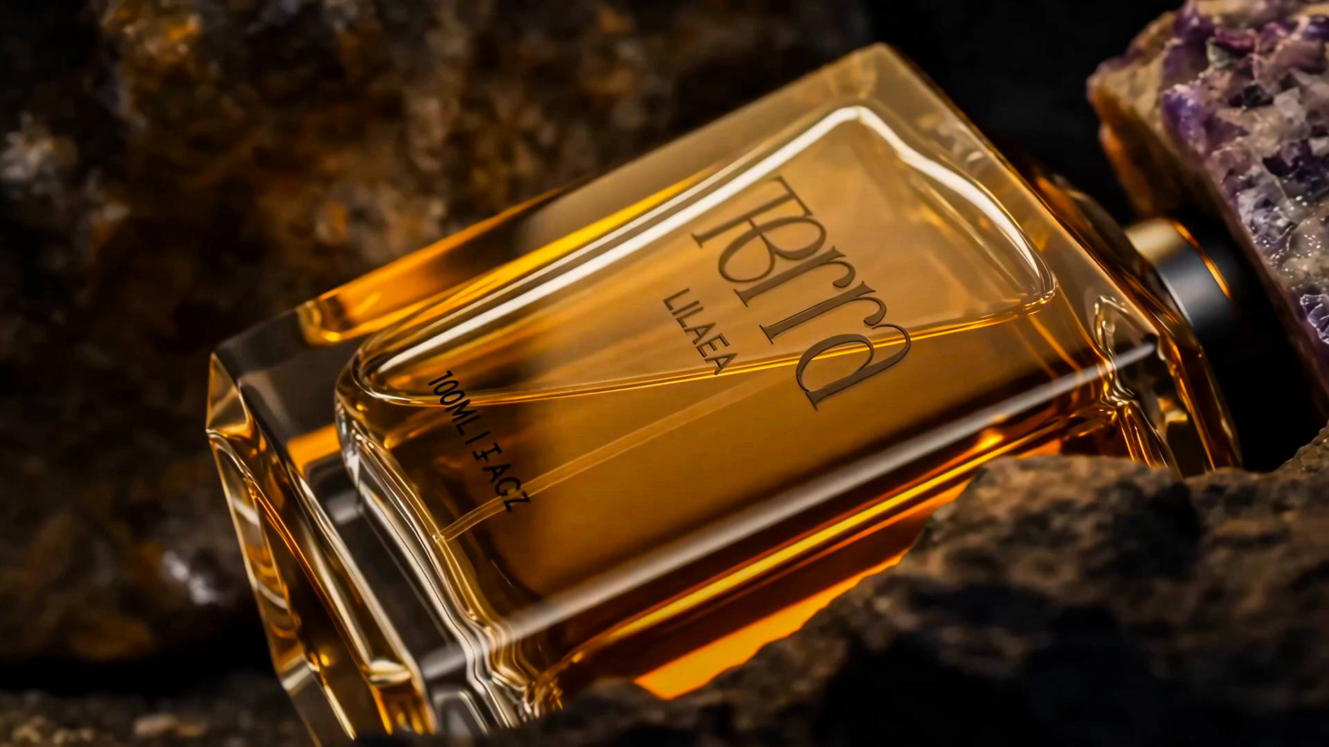 The amber TERRA perfume bottle resting among crystals